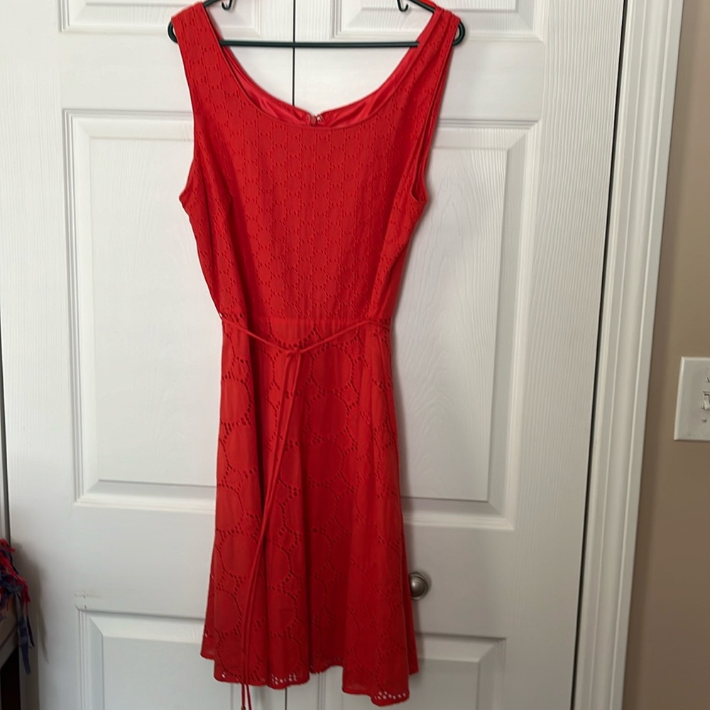 Orange cotton eyelet dress. Great detail. Thin belt of same color.